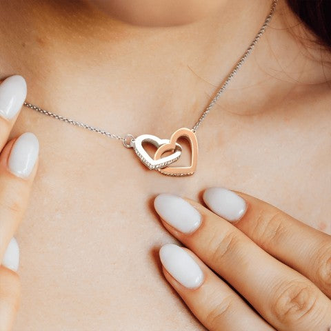 Interlocking Hearts necklace worn close to the heart