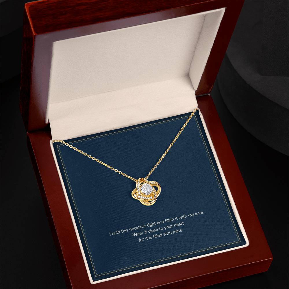 Love Knot necklace, 18k yellow gold, on a keepsake card for Daughter, in a luxury wooden box (view 2)