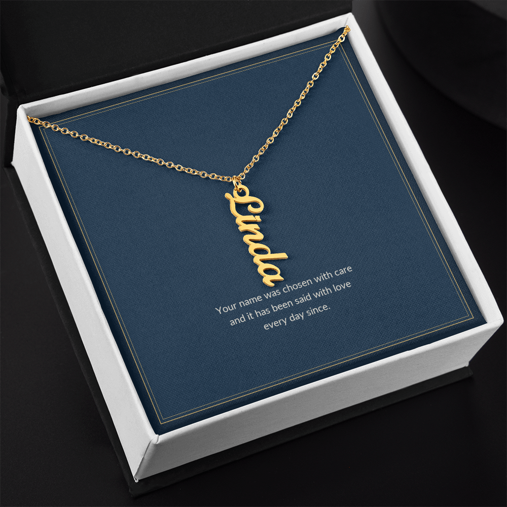 Vertical Name necklace, 18k yellow gold, on a keepsake card for Granddaughter, in a standard gift box (view 2)