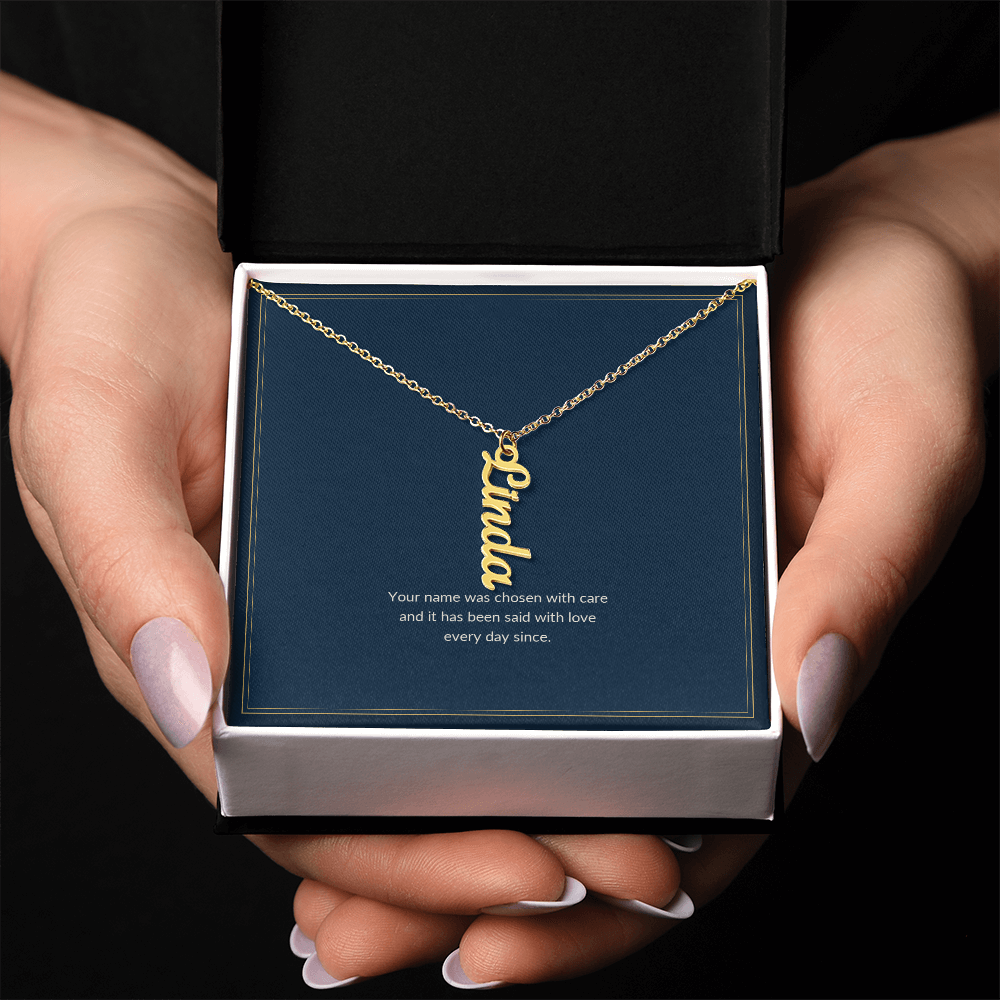 Vertical Name necklace, 18k yellow gold, on a keepsake card for Granddaughter, in a standard gift box (view 3)